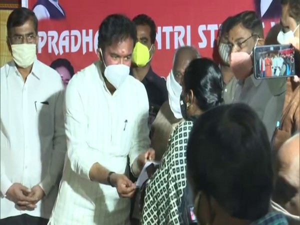 Minister of State G Kishan Reddy distributing financial assistance cards in Hyderabad. (Photo/ANI)