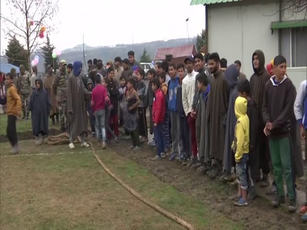 Young children in the Baramulla district playing games at the Indian Army's outreach program. (Photo/ANI)