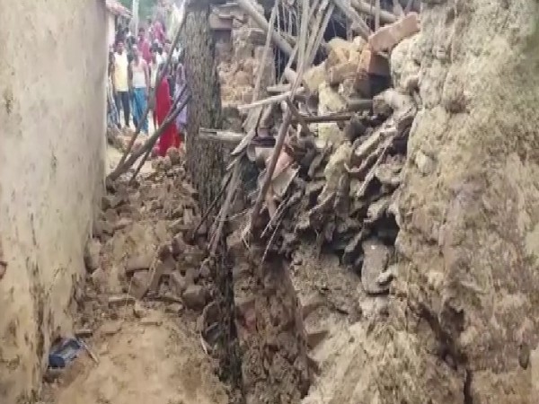 Wall of a 'kuccha' house collapsed in Tilwari village of Banka district in Bihar on Sunday. Photo/ANI