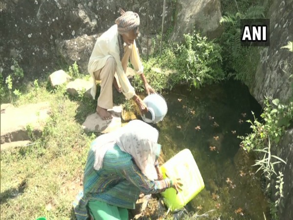 Prey villagers fetching water from a distant village's Chashma. (Photo/ANI)
