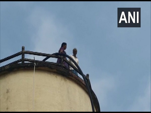 Elderly couple climbed atop a water tank in Harishchandrapuram village in Krishna district in Andhra Pradesh on Friday