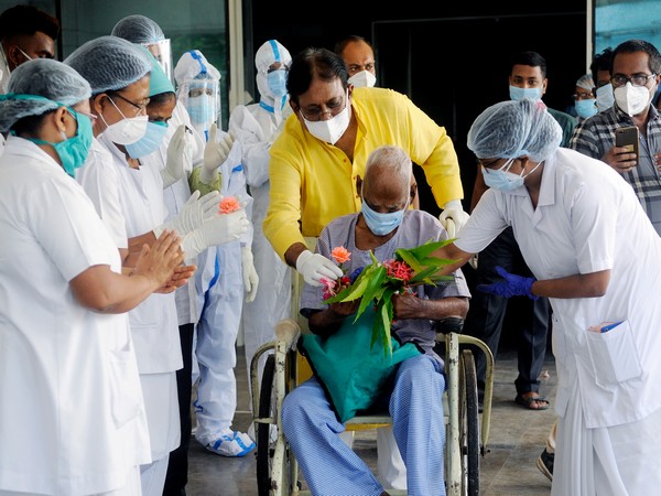 A 94-year-old man being greeted by medical staff after he was declared corona free in Kolkata on June 25. (Photo/ANI) 
