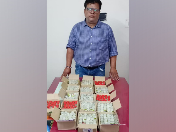 The arrested man with the seized batch of counterfeit Remedisivir drugs. (ANI)
