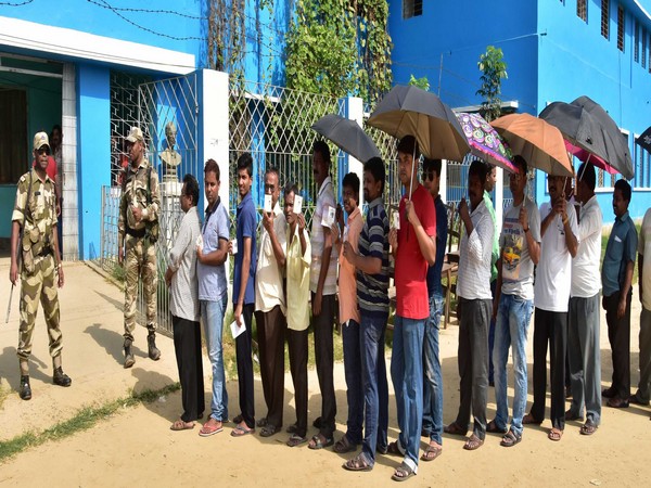 People in queue to cast their votes at a polling booth in Nadia in West Bengal on Monday. Photo/ANI