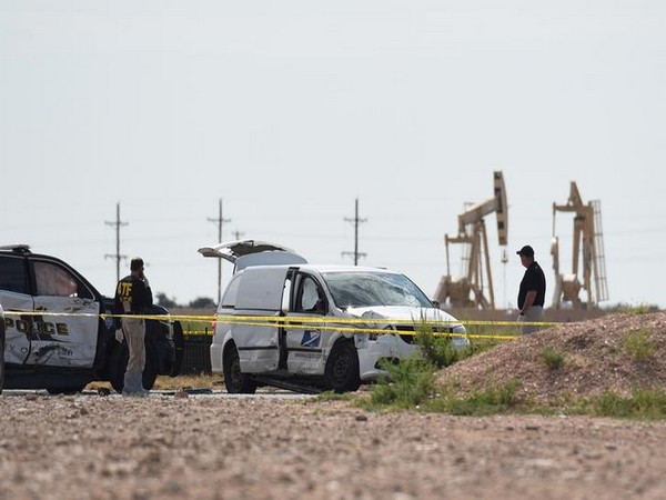 Officials investigate the stolen mail truck used by the shooter in West Texas on Saturday