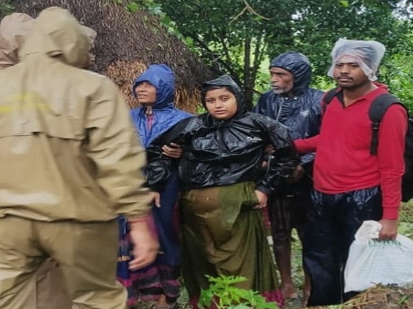 A pregnant woman being rescued by the fire personnel on Saturday. Photo/ANI