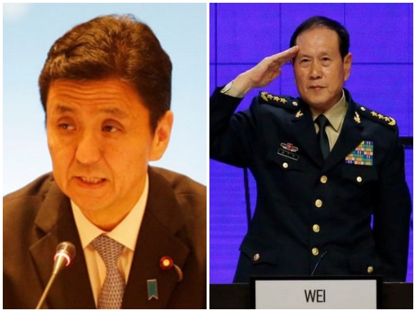 Japanese Defence Minister Nobuo Kishi (l) and Chinese Defence Minister Wei Fenghe