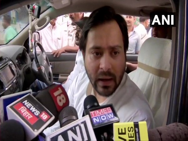 RJD leader Tejashwi Yadav talking to media persons in Patna on Friday 
