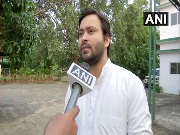 RJD leader Tejashwi Yadav talking to ANI in Patna on Sunday.