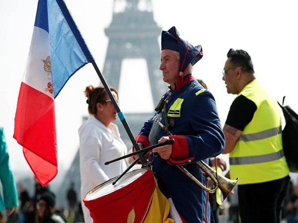 A protester in front of the Eiffel Tower in Paris, France, on March 23