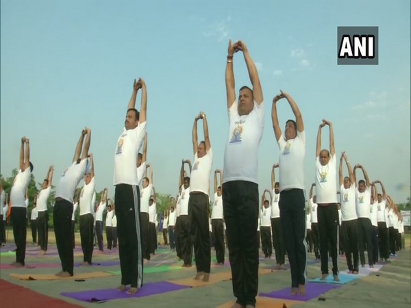 BSF personnel near the International Border in RS Pura while performing Yoga on Thursday. (Photo: ANI)