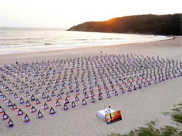 Indian Navy performs Yoga at Kamat beach, Karnataka (Photo/ANI)