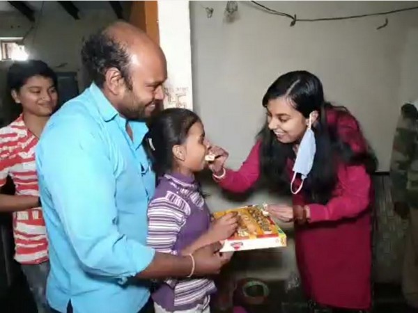 Khurja SDM Lavi Tripathi celebrates Diwali with the girl whose video went viral. (Photo/ANI)