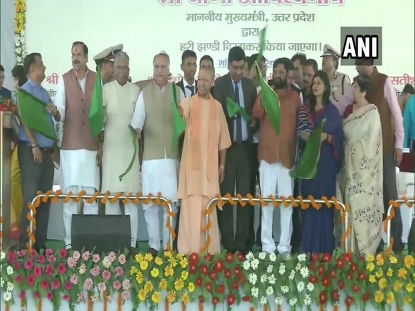 Uttar Pradesh Chief Minister Yogi Adityanath flagging off Delhi Lucknow Tejas Express on Friday. (Photo/ANI) 