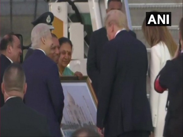Uttar Pradesh CM Yogi Adityanath presents large portrait of the Taj Mahal to US President Donald Trump in Agra on Monday (photo/ANI)