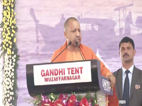 Uttar Pradesh Chief Minister Yogi Adityanath speaking at the event in Bijnor on Monday.