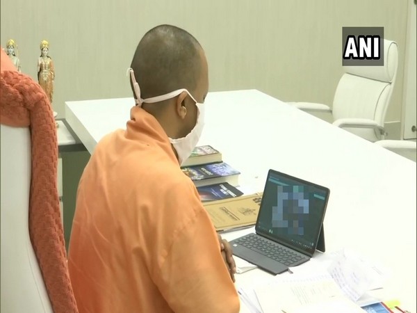 Uttar Pradesh Chief Minister Yogi Adityanath speaking to Hathras victim family on Wednesday. (Photo/ANI)