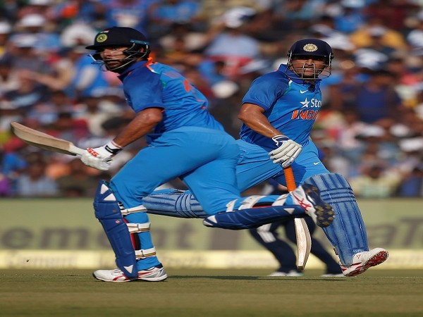 India's Mahendra Singh Dhoni and Yuvraj Singh run between the wickets during the match