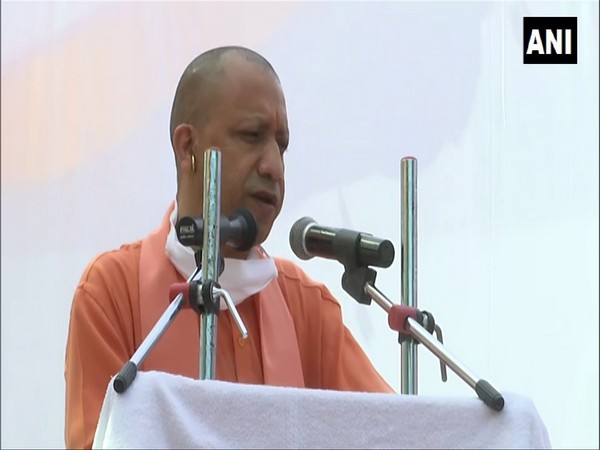 UP Chief Minister Yogi Adityanath addressing an event in Varanasi on Sunday. (Photo/ANI)