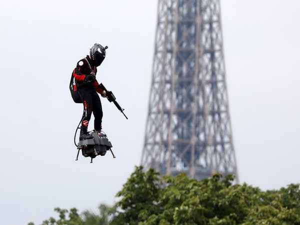 French inventor Frank Zapata on his turbine engine-powered hoverboard at the Champs Elysees in Paris for Bastille Day celebrations on Sunday (Photo/Reuters)