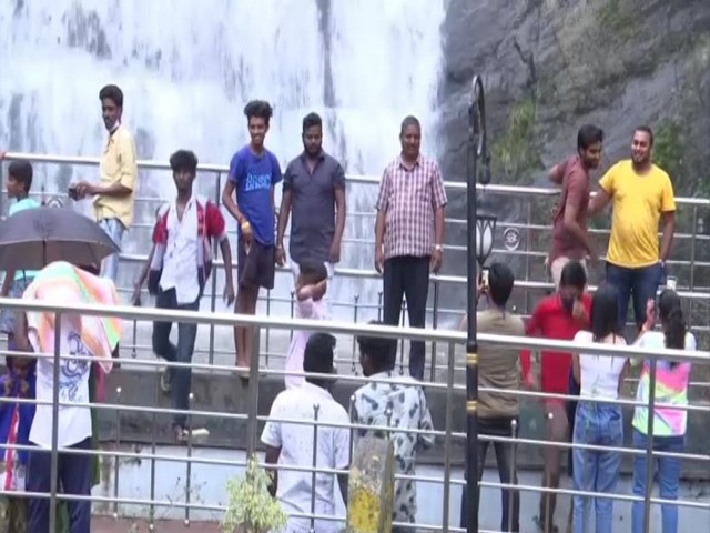 Tourists at Silver Cascade Falls in Kodaikanal. (Photo/ANI)