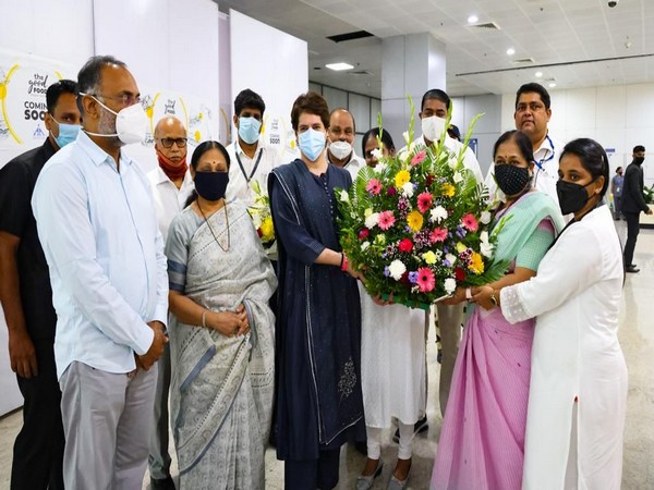 Priyanka Gandhi Vadra was welcomed at the airport with a bouquet of flowers by the party workers. (Photo/ANI)