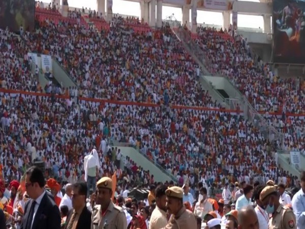 People gather at at Atal Bihari Vajpayee Ekana Cricket Stadium for swearing-in ceremony of Yogi Adityanath as Uttar Pradesh CM (Photo/ANI)